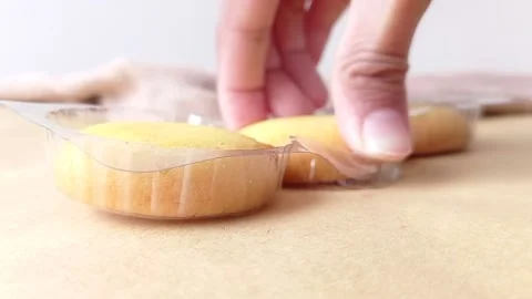 Two left sweet biscuits on a table Stock Footage 146249758