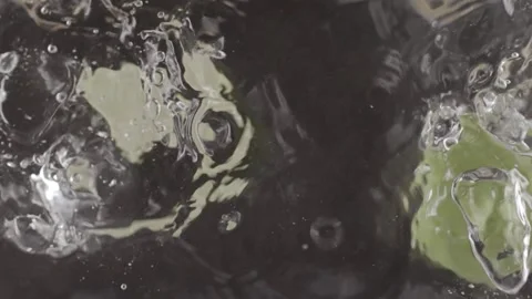 Two lemon halfs falling in clear fresh water. Stock Footage 146947908