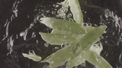 Two lemon halfs falling in clear fresh water. Stock Footage 146947961