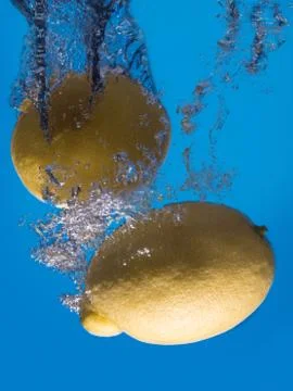 Two lemon splashing Stock Photos