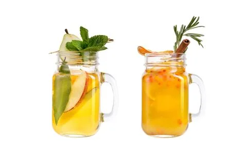 Two lemonade on a white background. A refreshing drink with a pear and a drin Stock Photos