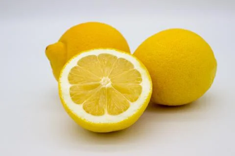 Two lemons and a half of a lemon isolated image on a white background Stock Photos