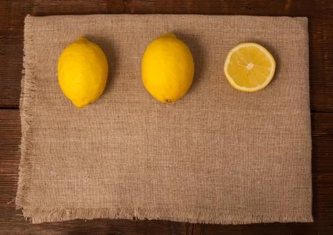 Two lemons and a slice Stock Photos