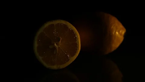 Two lemons lie on a dark background Stock Footage 89761492