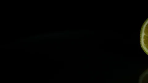 Two lemons lie on the table. Black background Stock Footage 89761439