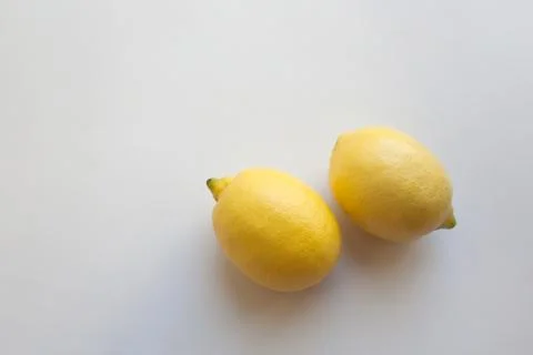 Two lemons on white background with a copy space Stock Photos