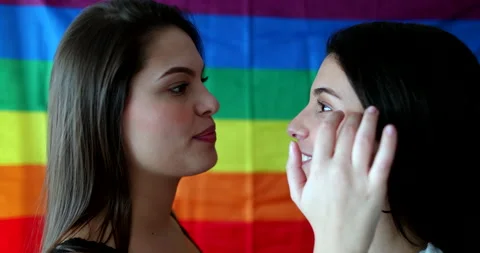 Two lesbian LGBT girlfriends interaction kissing and intimate moment Stock Footage 139023217