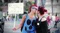 two lesbians kissing in the street demonstrating for their rights - gay pride HD Footage