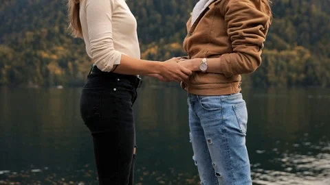 Two lesbians make an offer to get married and agree, attractive girls young Stock Footage 121156704