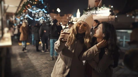 Two lesbians meet at xmas time. Prague old town square. Pride, lgbt, love Video stock 139753002