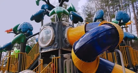 Two-level playground with palm trees on the street Stock Footage 274092048