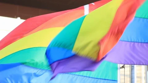 Two LGBT Pride Flags Blown Together Vídeo Stock 105146516