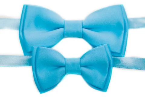 Two light blue bow tie isolated on white background, big and small Stockfoto's