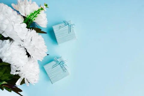 Two light blue gift box with white bouquet of flowers. Stock Photos