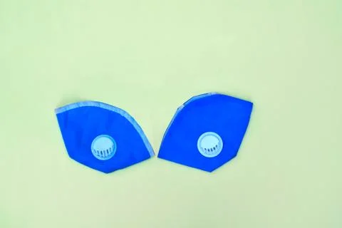 Two light blue pollution mask with rubber straps isolated on a white backgrou Foto stock