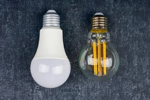 Two light bulb LED on gray background Stock Photos