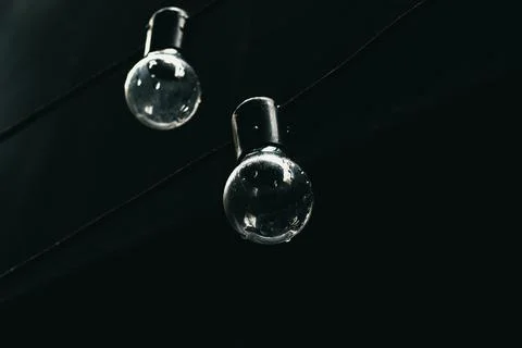 Two light bulbs on black background Foto stock