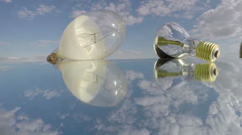 Two light bulbs on mirror, time lapse 4K Stock Footage 62910154