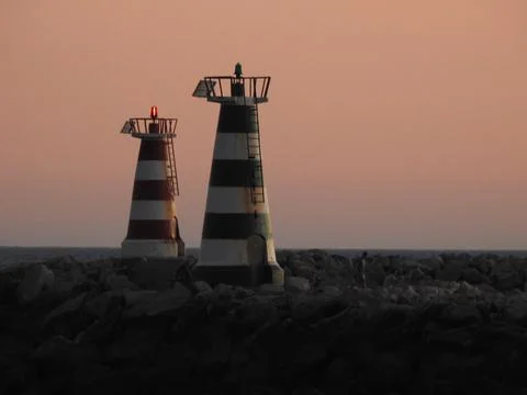 Two light houses on the rocks Stock Photos