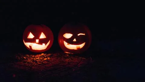 Two Lighted Jack O Lanterns at Night Time Stock Photos