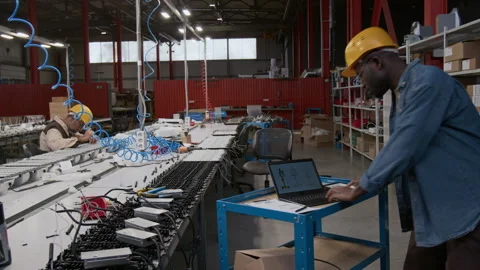 Two Lighting Factory Engineers Assembling Industrial Lamps to Fulfill Order Stock Footage 300140288