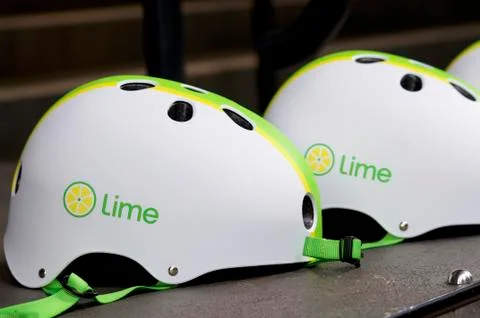 Two Lime E-scooter helmets Stock Photos