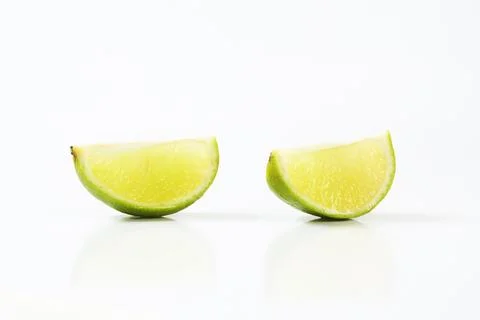 Two lime quarters Stock Photos