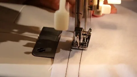 Two lines of black thread on white cloth. Close up Video stock 69255116