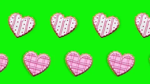 Two lines with Heart shape ginger breads decorated with pink and white Stock Footage 168327835