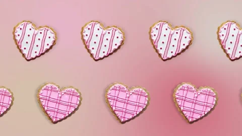 Two lines with Heart shape ginger breads decorated with pink and white sugar Stock Footage 168328445