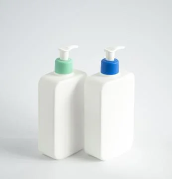 Two liquid containers for gel, lotion, cream, shampoo, bath foam. Cosmetic Stock Photos