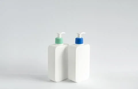 Two liquid containers for shampoo, gel, lotion, cream, bath foam etc. Blank Stock Photos