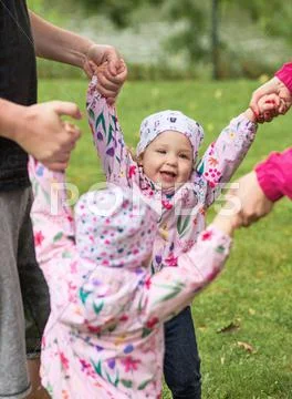 The two little baby girls playing in autumn park Stock Photos