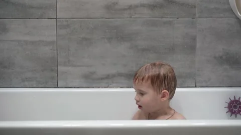 Two little boys having fun while taking bath in bathtub. Stock Footage 331253829