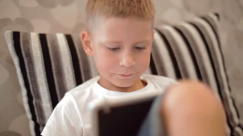 Two little boys playing on the tablet computer games Stock Footage 40331783