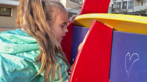 Two little sisters draw crayons on the playground Stock Footage 153490235