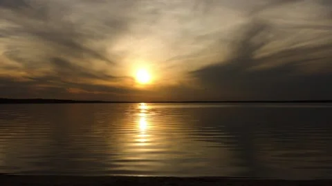 Two little sisters happily playing and having fun in front of the setting sun Stock Footage 216054089