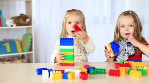Two little sisters playing with the constructor. DOLLY HD 動画素材 8956859