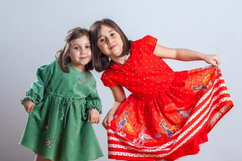 Two little sisters posing for the camera in the studio Stock-Fotos