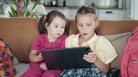 Two little sisters use digital tablet computer Stock Footage 256667902