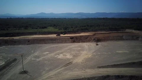 Two loaded trucks are moving by quarry, working on a quarry, top view Stock Footage 114651579