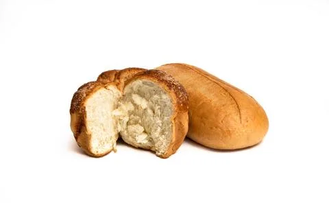 Two loaves of bread, one of them is round with a slice cut off. Foto stock