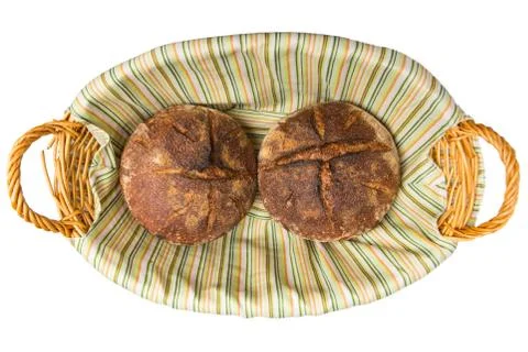 Two loaves of  sourdough bread in bread basket Stock Photos