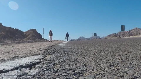 Two local Egyptians are on the road Stock Footage 119802574