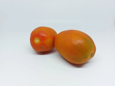 Two local fresh tomato isolated on white background Stock Photos