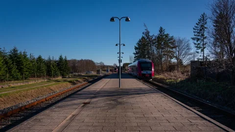 Two local trains passing each other at small station in Denmark Stock-Footage 341979592