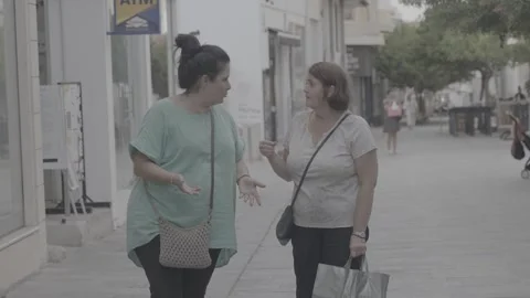 Two local women talking to each other in Paphos, Cyprus Video stock 344056750