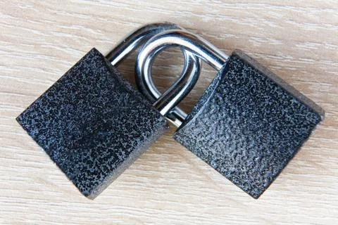 Two locks with bows are linked together. Stock Photos