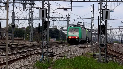 Two locomotives passing alone in a large railway yard - C0018 Stock Footage 290859018