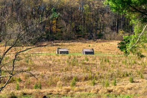 Two Log Cabins in a Large Field in Valley Forge National Historical Park Stock Photos